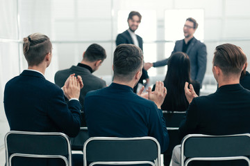 Fototapeta premium working group applauding business partners during the meeting