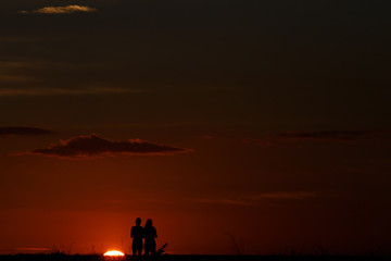 Fototapeta na wymiar Couple Watching Sunset