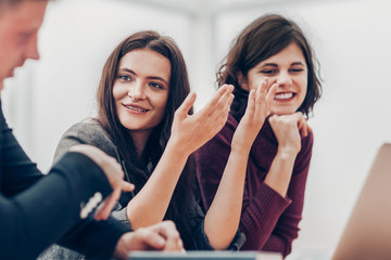 group of young people discussing online news