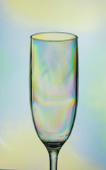 Empty champagne glass, creative photo style, colorful plastic