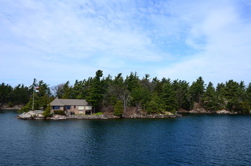 Fototapeta na wymiar A small island in Saint Lawrence River