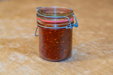 Appetizing homemade sweet sugar jam with sea buckthorn berries