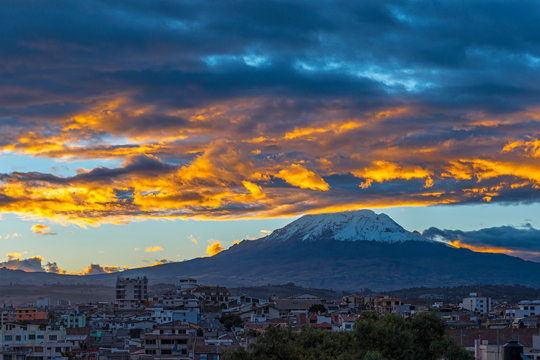 The Chimborazo Volcano at Sunset and the city of Riobamba, Ecuador.