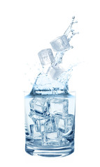 Water splashing out of glass with ice cubes on white background. Refreshing drink