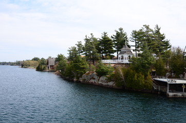 Fototapeta premium One Island in Thousand Islands Region in fall of New York State, USA