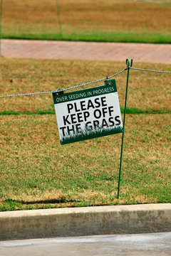 "Please Keep Off The Grass" sign