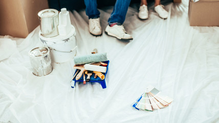construction tools and color palette on the floor in the new apartment.