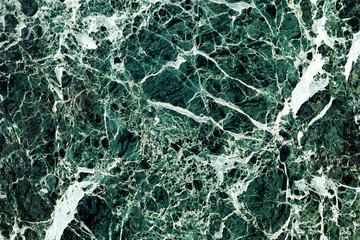 The texture is dark green marble with white veins. Material for wall and floor finishing. The...