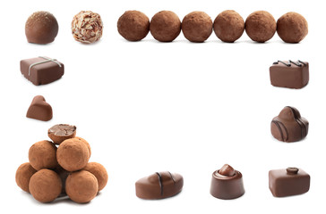 Set with different chocolate candies on white background, space for text