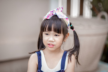 Close up background view Of ASEAN girls eating delicious ice cream, with chocolate flowing on clothes, the concept of self-learning