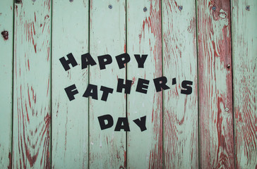 happy father's day written on wooden floor for father's day