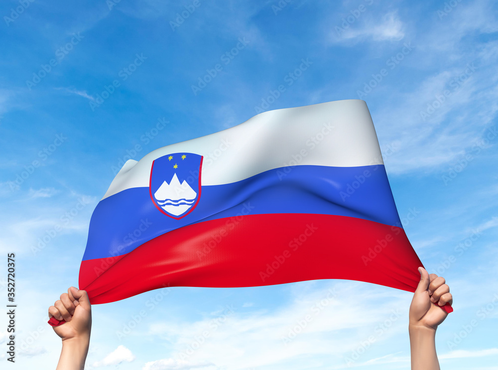 Wall mural two hands are holding a slovenia flag - flowing through the wind. 3d illustration.