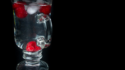 
Raspberry with ice in a water glass. Ready for entry.