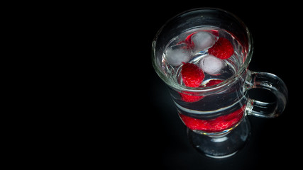 
Raspberry with ice in a water glass. Ready for entry.