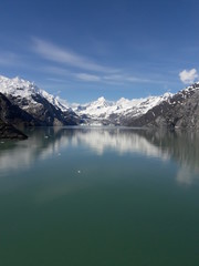 Fototapeta premium Alaska glacier, lake, canal, mountains and snow with a clear blue sky on a sunny spring day 2018