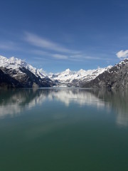 Obraz premium Alaska glacier, lake, canal, mountains and snow with a clear blue sky on a sunny spring day 2018