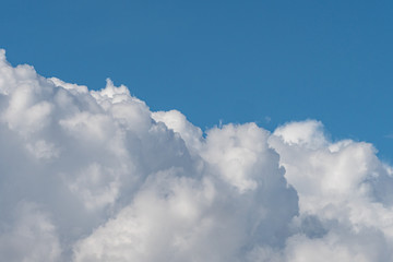 thick fluffy white cloud on the blue sky on a sunny day