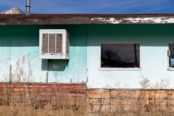 Abandoned building with an antique air conditioner