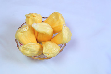 Fresh ripe jack fruit in a glass bowl isolated on white background