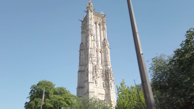 Saint Jacques tower in Paris and flag of France. Low angle process plate