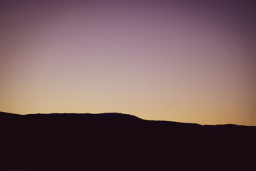 purple sunset over mountain range
