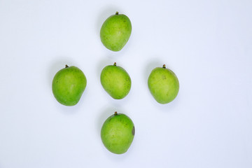 Fresh ripe green color mangoes isolated on white background