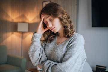 Worried young woman with hands on head