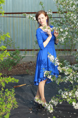 girl in blooming apple trees