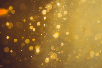 Dark Abstract Gold bokeh sparkle on black
