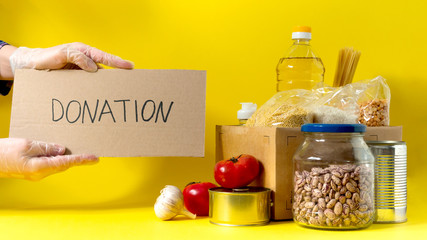 Banner.Donation. Food supplies crisis food stock for quarantine isolation period on yellow...