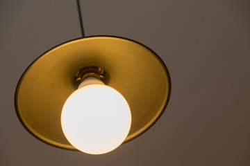 Lamp hanging on a gray wall