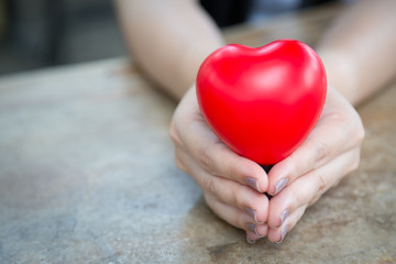 Woman hold red heart