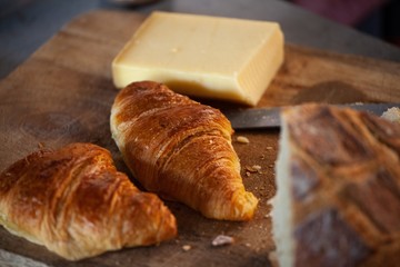 croissants and cheese on cuttingboard