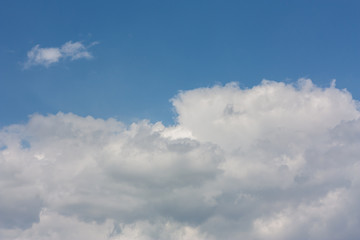 Naklejka na ściany i meble Beautiful white clouds in the spring sky of Krasnodar.