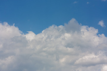 Naklejka na ściany i meble Beautiful white clouds in the spring sky of Krasnodar.