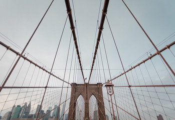 Symmetric View of Brooklyn Bridge in New York City, moody Style, on a cloudy Day