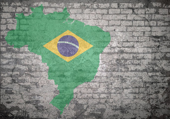 Grunge decayed faded brick wall background with the map flag of Federative Republic of Brazil