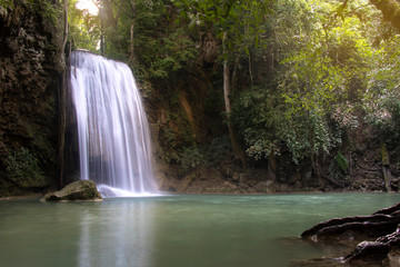 Fototapeta na wymiar Erawan waterfall the beautiful waterfall in forest at Erawan National Park. Kanchanaburi, Thailand