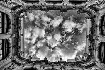 the windows of the building and the sky with clouds