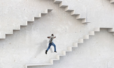 Image of businessman walking upstairs