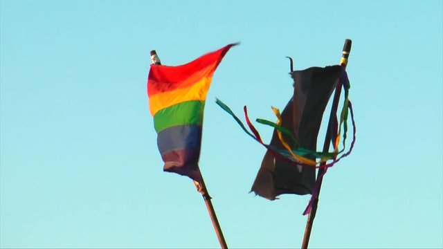 Flags flying in Mallory Square, Key west, Florida,  Pride flag and Pirate Flag blowing in the breeze.