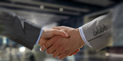 Partnership concept. Image of handshake