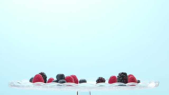 Transparent Glasses Full of Yogurt, Panna Cotta, White Vanilla Mousse Decorated with Berries