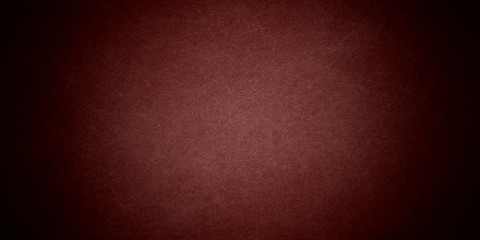 
Red abstract background. Toned fiberboard texture. Close-up. Burgundy vintage background. Black red grunge banner with copy space for your design