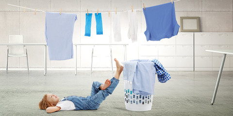 Happy little girl with washed clothes