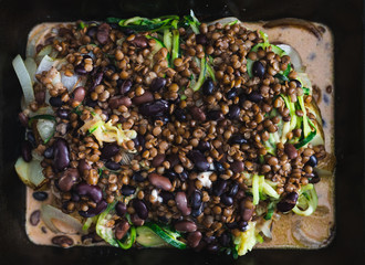plant-based food, vegan lentil and potato bake in oven tray