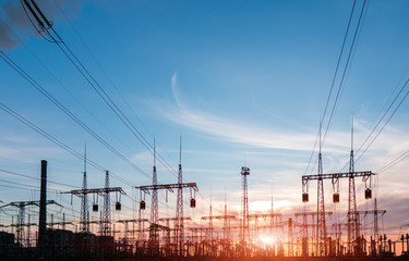 Electrical power lines and towers at sunset