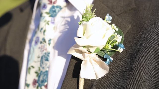 Floral Tie & Boutonniere on Male Wearing Classy Fancy Tuxedo, Close-up