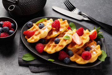 Delicious belgian waffles with summer berries