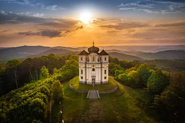 Fotobehang Poppy Mountain is a peak in the Benesov Hills and an important place of pilgrimage. Baroque church of St. John the Baptist and the Virgin Mary of Carmel was built between 1719 and 1722. © Marek
